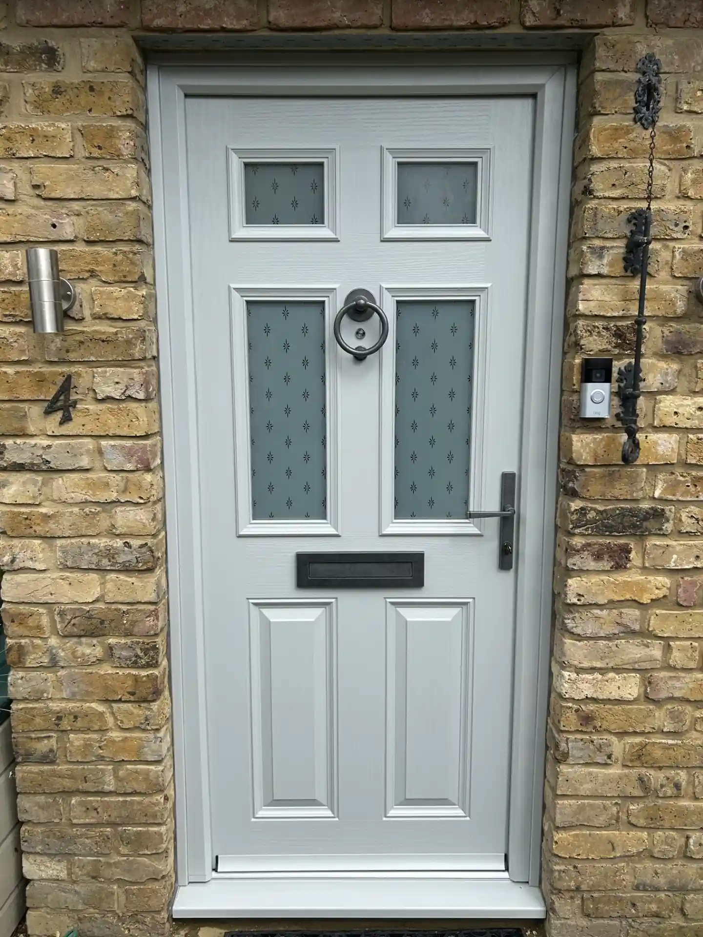 Composite front door with glazed side panel fitted in West London