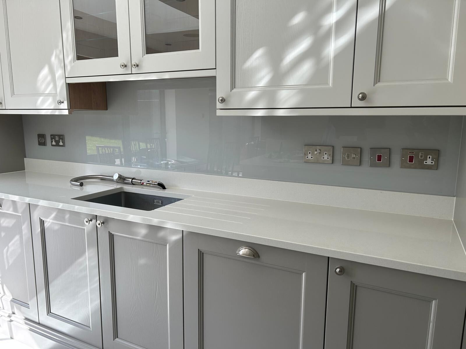Light grey glass splashback fitted in Ickenham by IM Glass